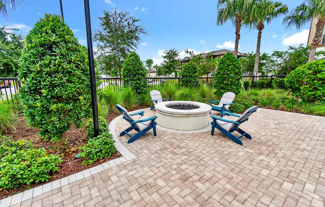 gather around the fire pit at the enclave at woodbridge apartments in sugar land, tx