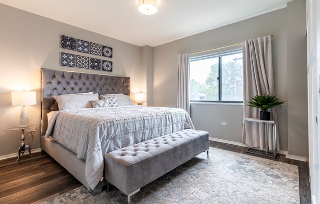 a bedroom with a bed and a window