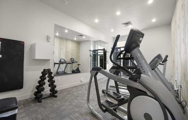 a gym with cardio equipment and weights at 200 City View, Provo, Utah