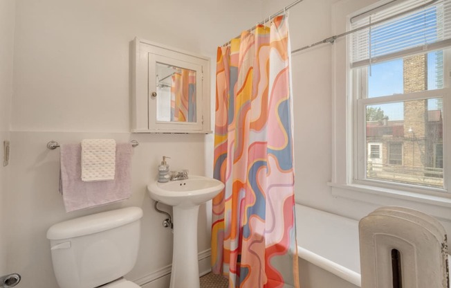 a bathroom with a toilet sink and bathtub