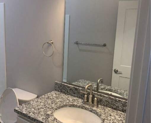 Bathroom With Vanity Lights at Warehouse Apartments, Fargo, North Dakota