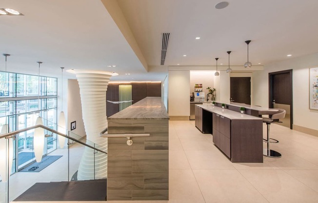 a kitchen with a long island and a spiral staircase