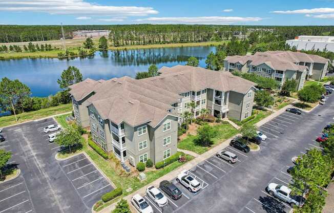 A large building with a parking lot in front of it.