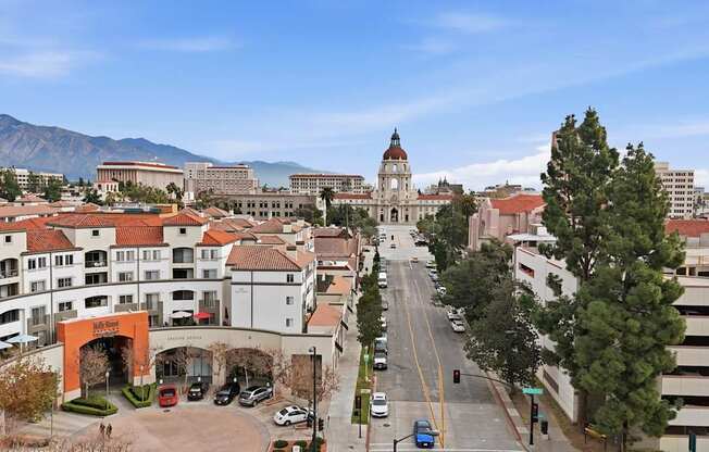 A city street with cars and buildings.