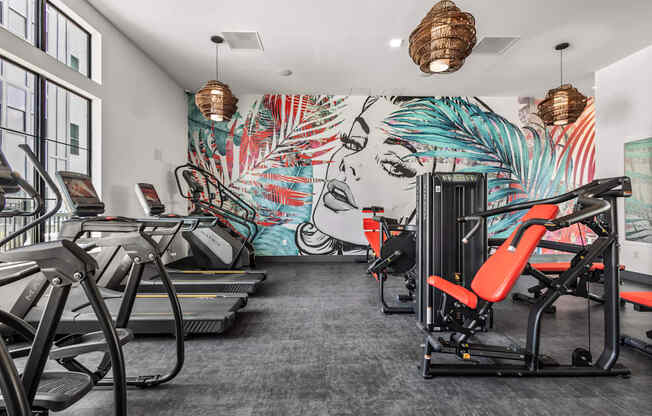 A gym with treadmills and exercise equipment.