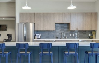 Modern blue chairs at clubhouse kitchen at WH Flats luxury apartments in south Lincoln NE