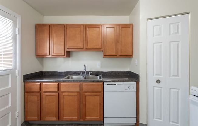 This is a photo of the kitchen of the 1004 square foot, 2 bedroom/1 bath Townhome with stackable washer/dryer floor plan at Colonial Ridge Apartments in the Pleasant Ridge neighborhood of Cincinnati, OH.