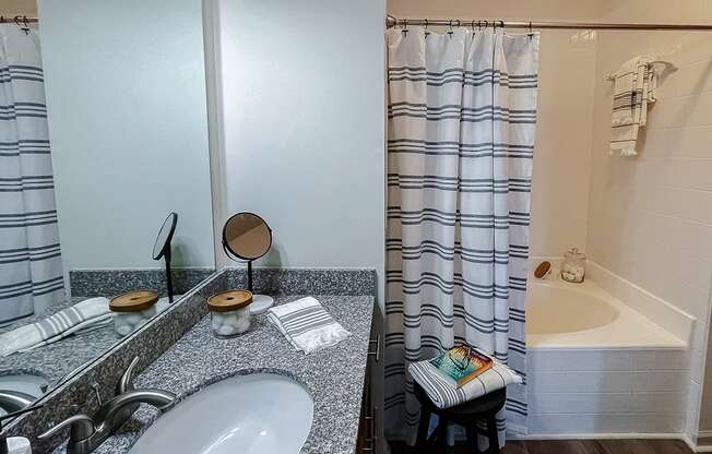 Vanity and tub/shower  at Two Addison Place Apartments , Pooler, GA, 31322