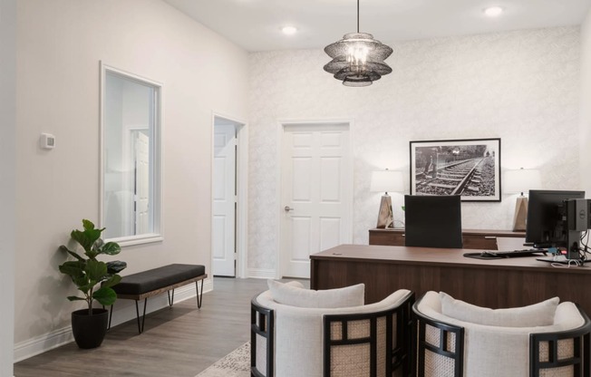 a home office with a desk and three chairs