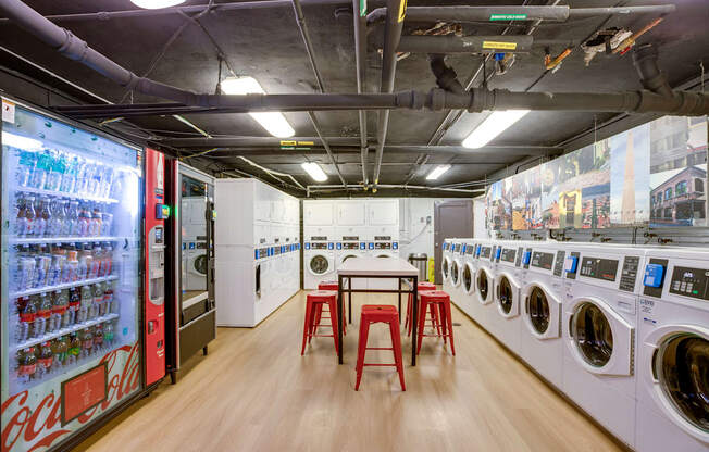 Laundry room with vending machines at Mason Hall in Alexandria, VA 22314