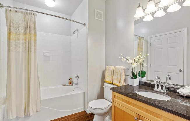 a bathroom with a sink toilet and a shower