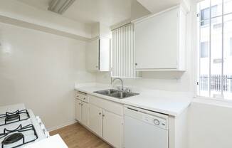 Kitchen with White Appliances and White Cabinets