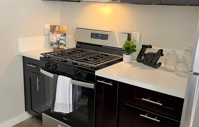 a kitchen with a stove and a microwave