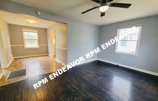 Charming 2-Bed Home with Hardwood Floors & Spacious Fenced Yard!