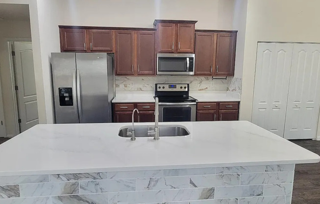 Charming 3/2 in a prime location with multiple upgrades including attache garage and screened in lanai