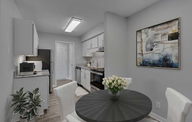 Step into modern living at Icon Downtown Durham. This stylish kitchen features sleek appliances and a cozy dining area perfect for entertaining or relaxing. Enjoy urban convenience and comfort. Schedule your tour today!