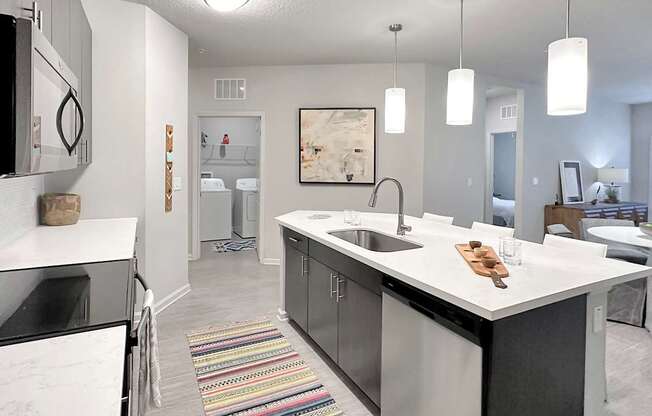 Quartz countertops and islands with overhead lighting