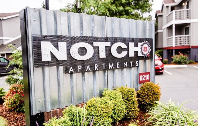 A sign for Notch Apartments is in front of a building. at Notch 8, Tacoma, Washington