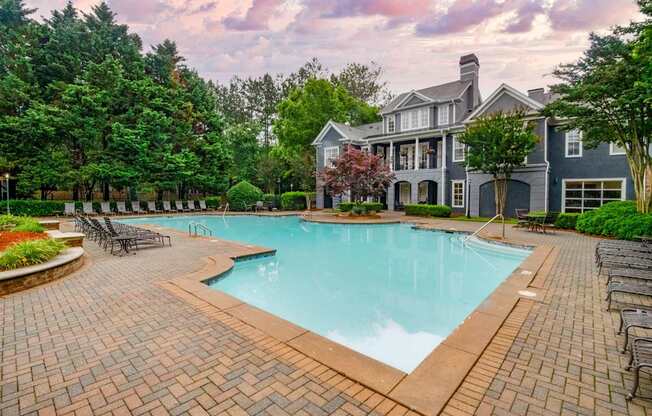 A large house with a pool in the backyard.
