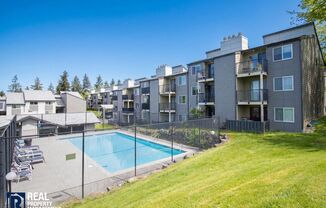 Renton Condo with Private Patio, Pool & Covered Parking!