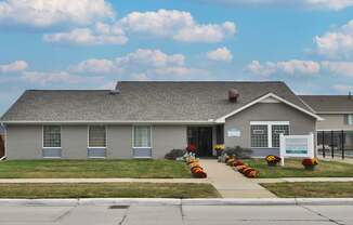 Leasing office at Farmbrooke Manor Apartments in Clinton Township MI with welcoming entrance and on-site parking