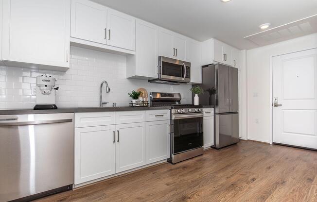 a kitchen with a stove and a refrigerator