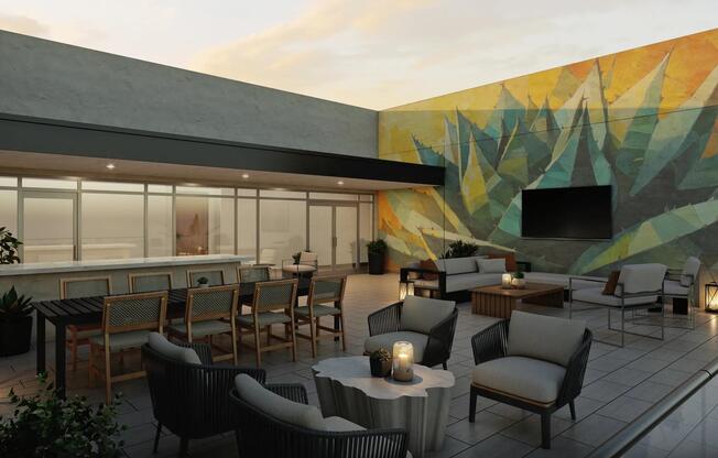 Rooftop lounge with lush landscaping and comfortable seating.