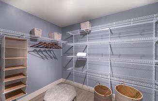 Oversized closet with ample shelving for organized storage.