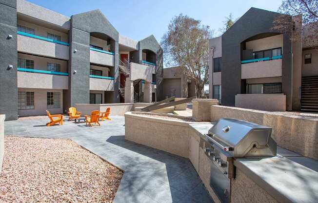 A modern building with a courtyard and a grill.