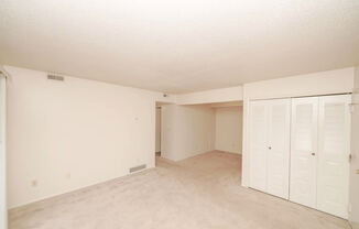 Living Room with Lots of Closet Space at Madeira Apartments in Kalamazoo, MI