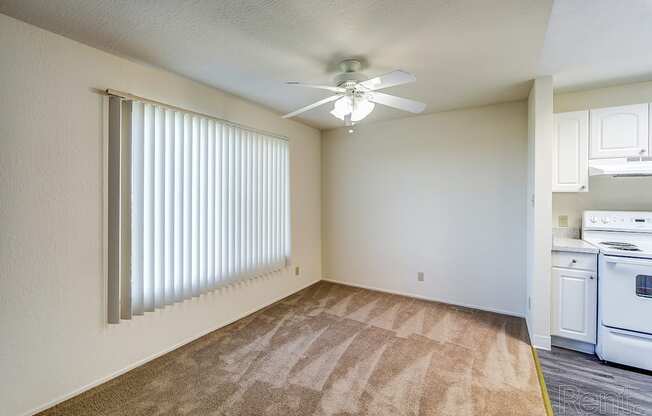 a bedroom with a ceiling fan and a window at Terrace View Apartments, California, 94015