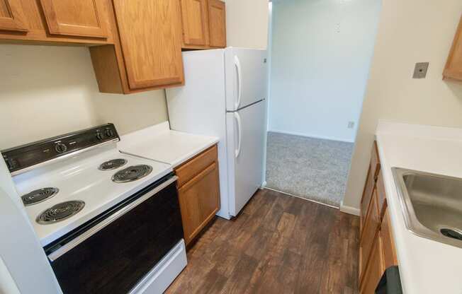 This is a photo of the kitchen in the 652 square foot, 1 bedroom, 1 bath A-style apartment at Blue Grass Manor Apartments in Erlanger, KY.