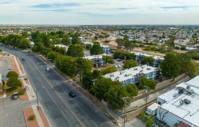 A city street with cars and buildings.