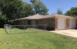 New paint and flooring in this 2 bed, 1 bath duplex with a 1 car garage for rent in Midwest City near Douglas and NE 10th!