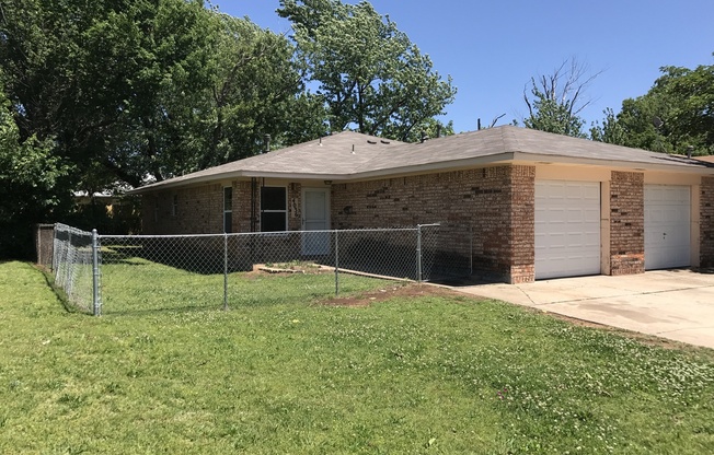 New paint and flooring in this 2 bed, 1 bath duplex with a 1 car garage for rent in Midwest City near Douglas and NE 10th!