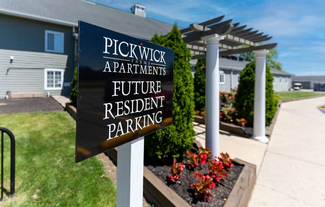 a sign that reads pickwick apartments future resident parking