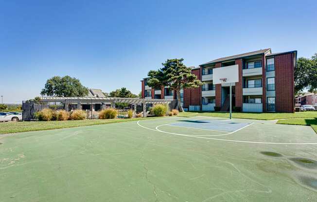 a basketball court in front of a building