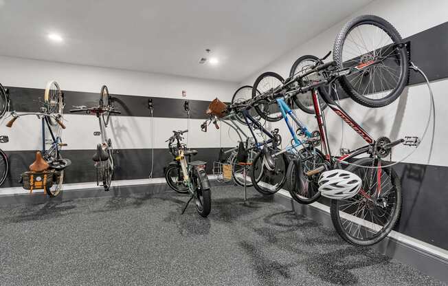 A bike shop with bikes hanging on the wall.