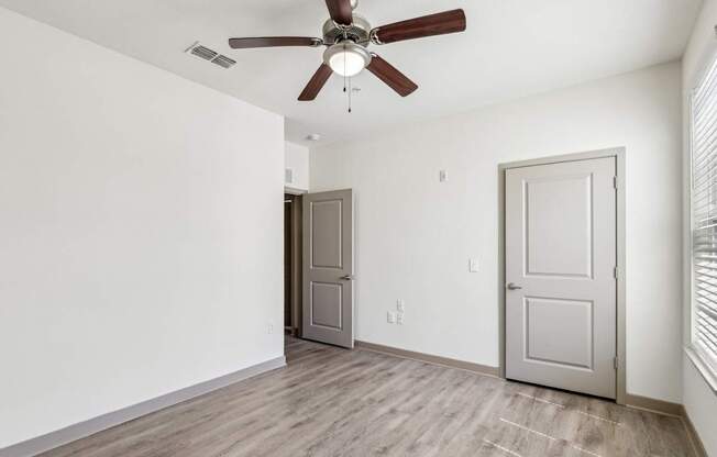Royal Palm bedroom with a ceiling fan at Oakleaf Plantation apartments in Jacksonville, FL.