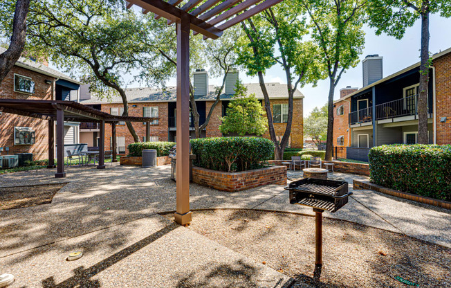 our apartments have a spacious courtyard with a grill and trees