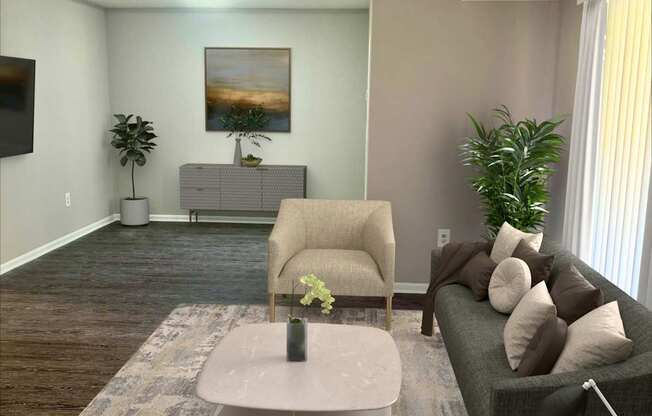 A living room with a grey couch, a coffee table, and a television.