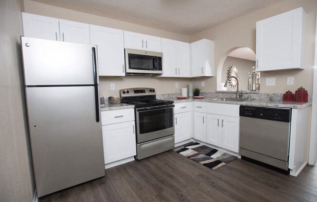 A kitchen with white cabinets and a refrigerator at Ridge Crossings Apartments, Hoover, 35244