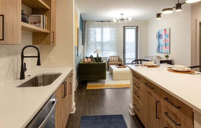 a kitchen and living room in an open floorplan apartment