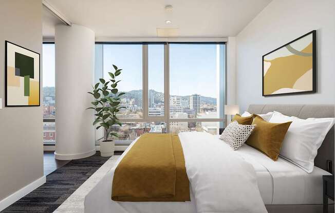 A bedroom with a large bed and a view of the city.