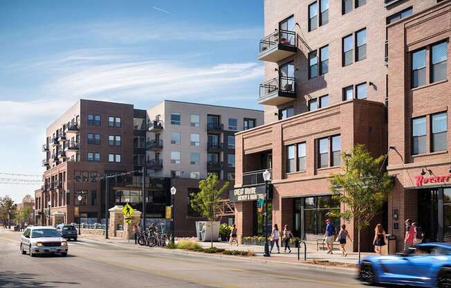 a city street with people walking and cars driving