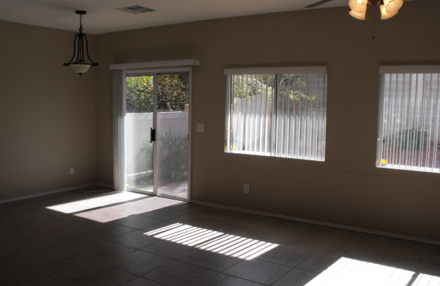 Spacious Henderson townhouse featuring   3 bedrooms PLUS 2 car garage.