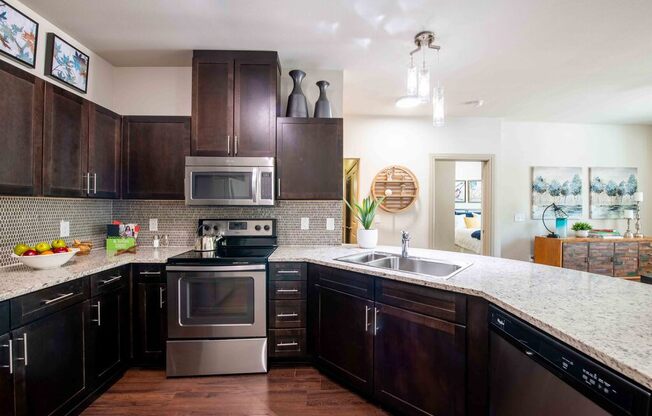 a kitchen with brown cabinets and a counter top