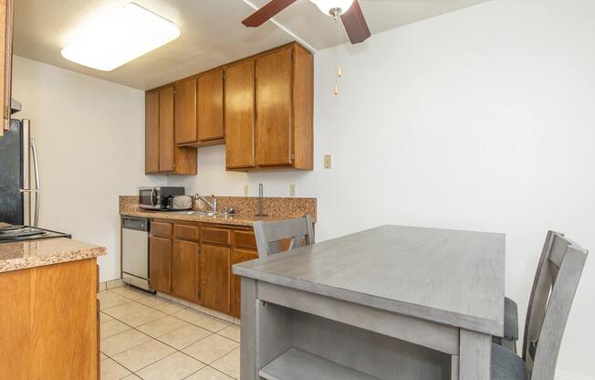 a kitchen with a stove and a refrigerator