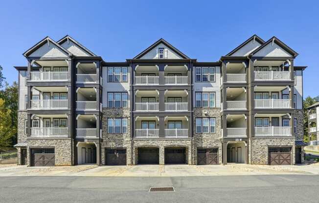 From view of the apartment building with a parking garages built-in at Evergreen at Southwood in Tallahassee, FL