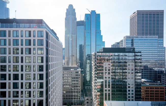 A cityscape with various buildings of different heights and designs.